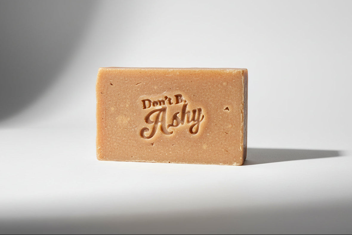Bar of soap with 'Don't B. Ashy' branding on a dark background