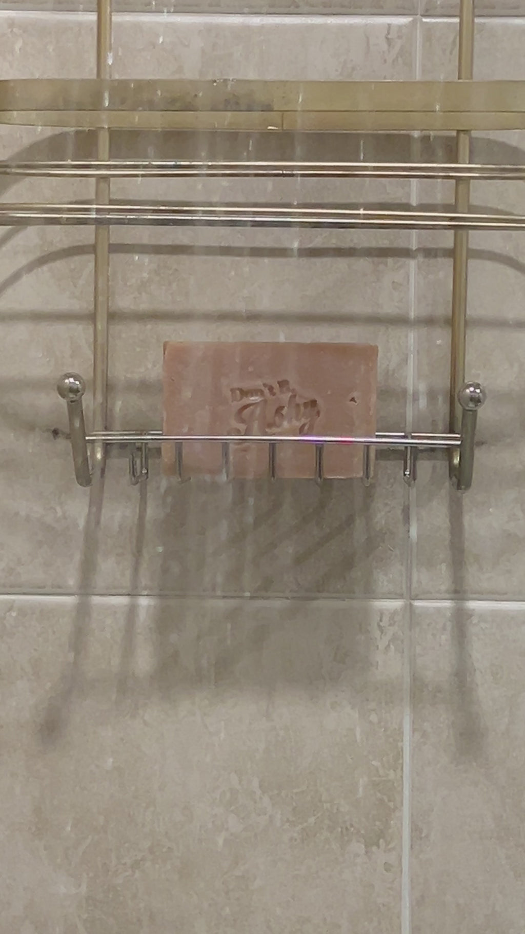Soap in soap dish inside shower.
