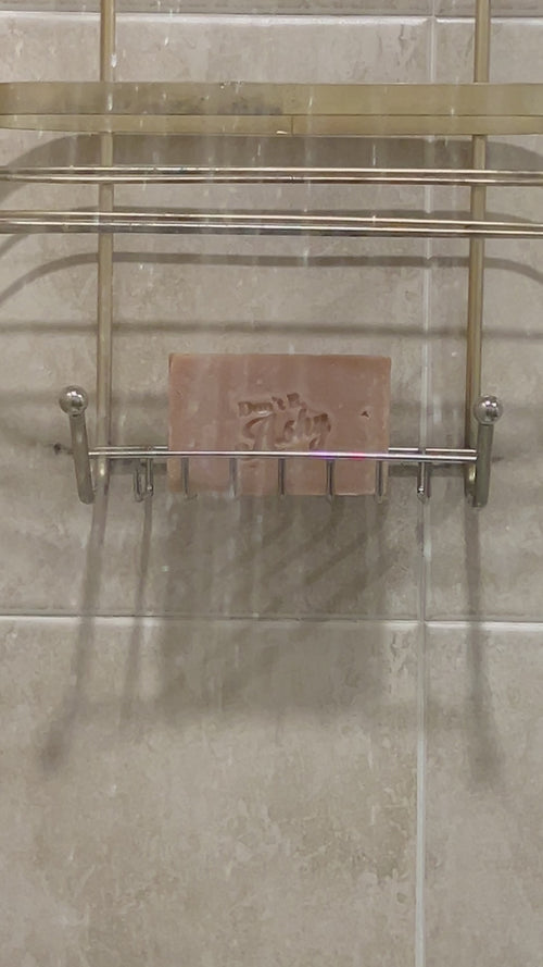 Soap in soap dish inside shower.
